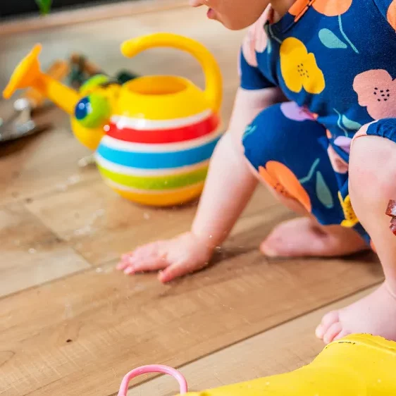 Baby playing on a waterproof cortec floor
